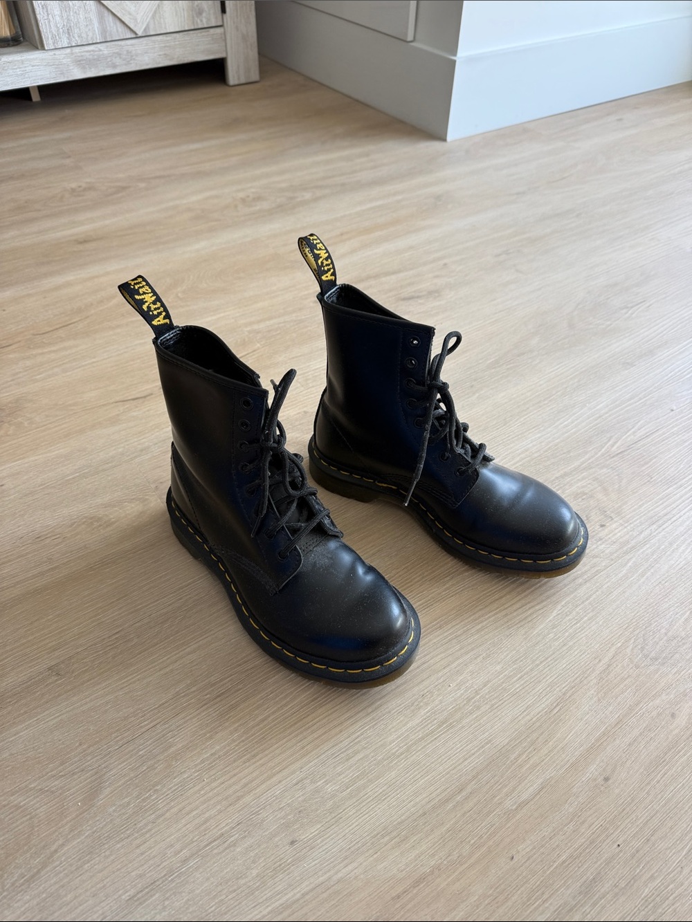 Dr. Martens women’s Black Leather Lace-Up Boots with Yellow Stitching